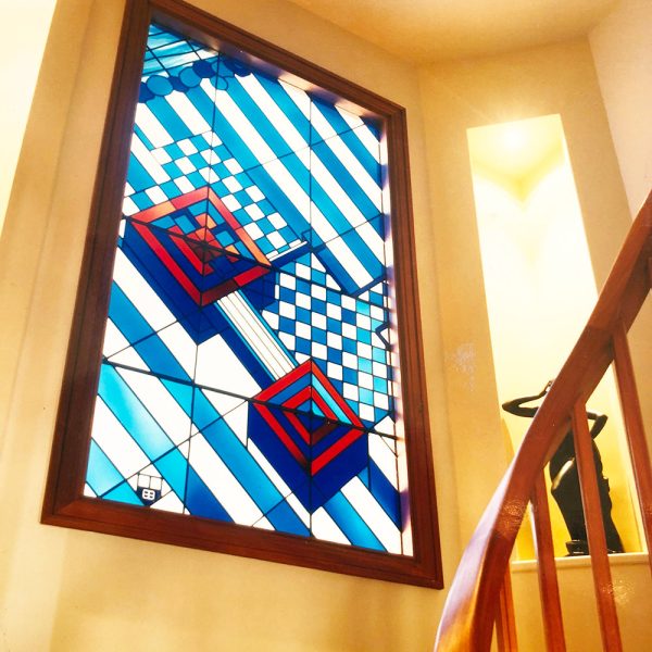 A piece of architectural stained glass - semi-abstract aerial view of new property