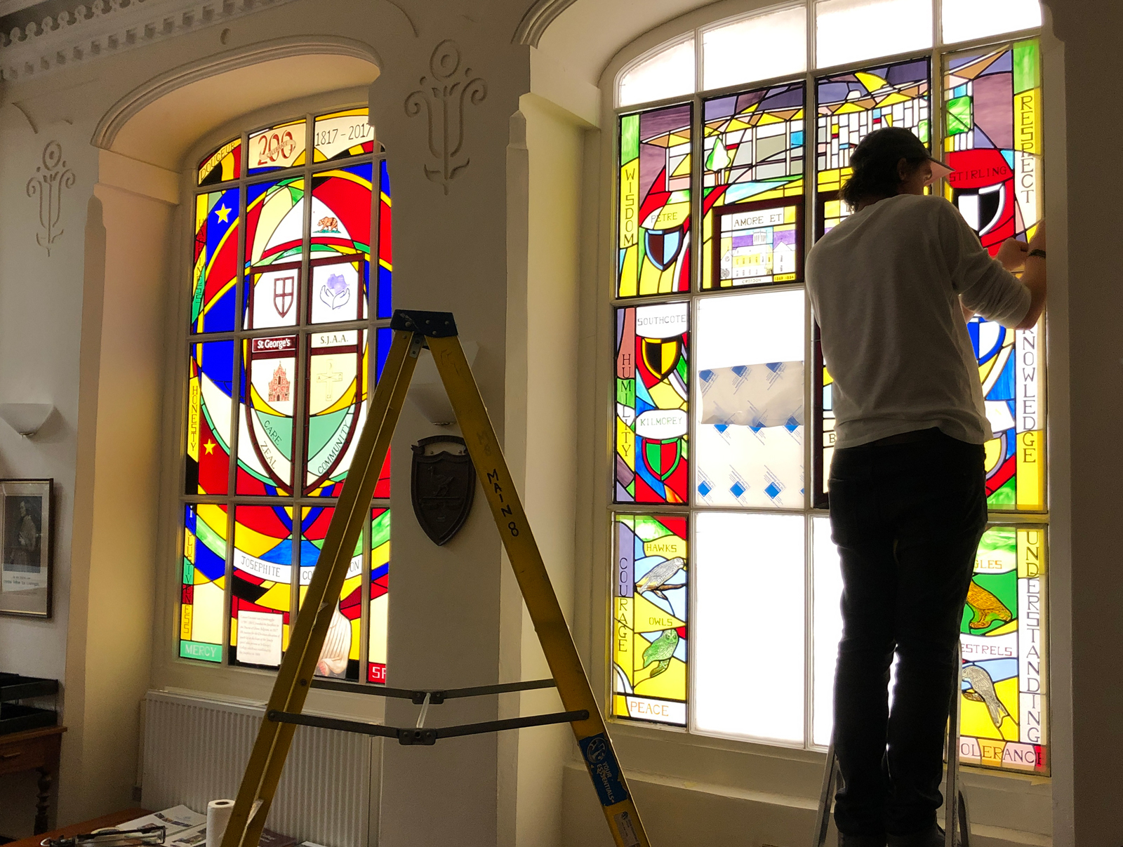 Installation of stained glass in progress